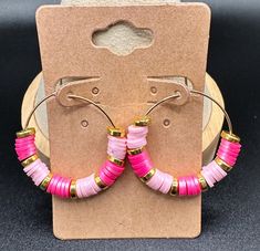 Theme: Hoop Earrings This pair of earrings features clay beads in dark and light pink with gold spacer beads. These are Tierney's designs.  They are 1.25" long. Trendy Pink Hoop Earrings With Round Beads, Nickel-free Pink Beaded Hoop Earrings, Pink Small Hoop Beaded Earrings As Gift, Adjustable Pink Hoop Earrings, Adjustable Small Pink Hoop Earrings, Pink Adjustable Small Hoop Earrings, Small Pink Hoop Earrings Nickel Free, Make Clay Beads, Bead Hoop Earrings