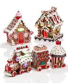 a group of gingerbread houses with candy on them