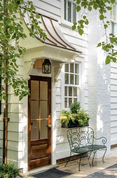 a white house with a wooden door and window