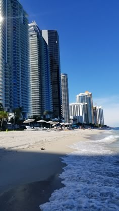 the beach is lined with high rise buildings