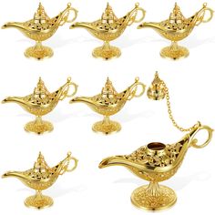 golden teapots with chains on them are set against a white background for display