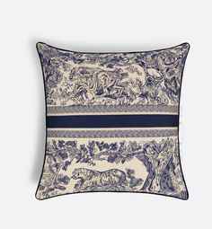 a blue and white pillow with an image of animals on the front, in two different colors