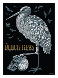 a person holding up a poster with a bird on it's back and the words black keys written in gold