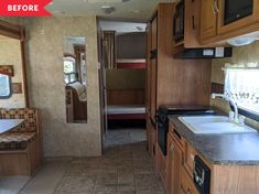 the inside of an rv with wood cabinets and tile flooring is shown in this image