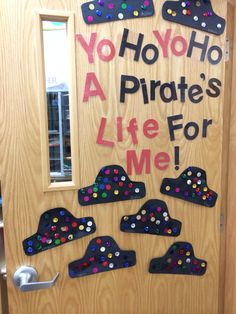 a door decorated with magnets that say no ho hoo, a pirate's life for me