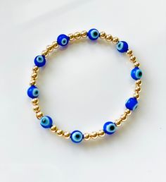 I love these mini blue evil eye beads! Paired with 4mm 14K gold filled or sterling silver beads. Perfect to stack or wear alone! I love jewelry that is personal and tells a story. Let me know how I can personalize pieces for you! - need a special size you don't see? Message me and I will be happy to do my best to accommodate :) Care for your LeLu jewelry- ALWAYS roll bracelets onto your wrist! Try to avoid stretching them as much as possible. This will help them last longer. I never take mine of Blue Spiritual Stackable Jewelry, Everyday Blue Jewelry With 8mm Beads, Blue Stackable Jewelry For Everyday, Blue Stackable Jewelry With Round Beads, Blue Stackable Everyday Jewelry, Spiritual Blue Beaded Bracelets For Everyday, Everyday Spiritual Blue Beaded Bracelets, Blue 14k Gold Filled Bracelet Jewelry, Blue 14k Gold-filled Bracelet Jewelry