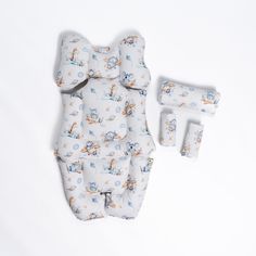 a baby's diaper and its accessories laid out on a white surface,