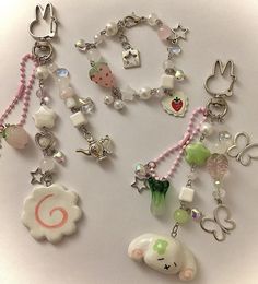 a collection of various charms on a white surface