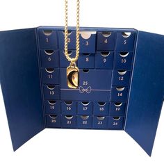 a blue card with a gold chain hanging from it's front and back sides