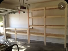 the inside of a garage with shelves in it