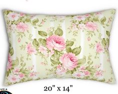 the pillow has pink flowers on it