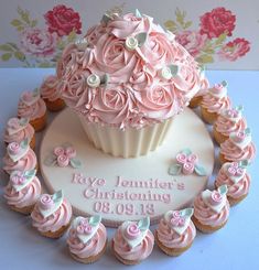 a cupcake decorated with pink frosting and roses