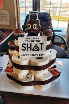 there is a cake that says we think you're the shot happy boss's day