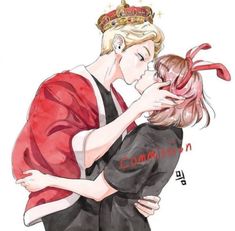 two people are hugging each other and one is wearing a crown