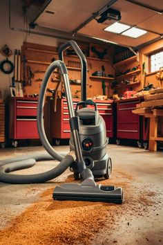 a vacuum is on the floor in a garage