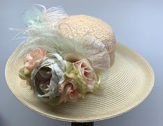 VICTORIAN WIDE BRIM HAT - 1126 Stunning wide brim natural hat with lace covering the crown, lace bow, gorgeous seafoam and mauve Roses, Ostrich and Peacock feathers. SIZE:  Medium, 22" - 22 1/2" inches for the head circumference.            There is an adjustable drawstring sweatband to adjust the fit if needed.  Please measure your head to make sure the hat will fit. No guessing please.  No returns if it does not fit. All heads are not the same. This hat will be made for you after you place you Beige Panama Hat For Garden Party With Flat Brim, Beige Flat Brim Boater Hat For Garden Party, Beige Flat Brim Panama Hat For Garden Party, Beige Brimmed Straw Hat For Garden Party, Cream Flat Brim Straw Hat For Garden Party, Beige Short Brim Straw Hat For Garden Party, Vintage Beige Hat For Country Events, Beige Short Brim Fascinator For The Beach, Beige Short Brim Fascinator For Beach