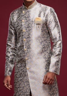 Ready-Made Sherwani With Peshawari Trouser. All Over Jacquard Brocade Style Fabric Top. Art Silk Peshawari Ready Made Trouser. Crafted in Chinese Collar Neck, and Full Sleeve. Satin Lining with Plain Work. High-Quality Matching Buttons. Please Note: The footwear shown in the picture is for presentation and photography purpose only. Color: There might be slight color variation due to lightings and flashes while photo shooting. The color may also vary because of different screen resolutions. Wash Formal Bollywood Salwar Kameez With Cutdana, Formal Salwar Kameez With Zari Work For Transitional Season, Designer Brocade Salwar Kameez For Eid, Eid Brocade Designer Salwar Kameez, Eid Designer Wear Salwar Kameez In Brocade, Formal Bollywood Traditional Wear With Traditional Drape, Formal Bollywood Traditional Wear With Drape, Festive Sherwani With Cutdana On Jamawar Fabric, Festive Designer Brocade Unstitched Suit