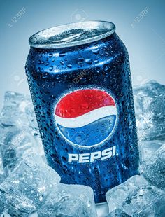 a can of pepsi sitting on top of ice