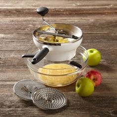 an image of apples being cooked in the bowl with graters and strainers