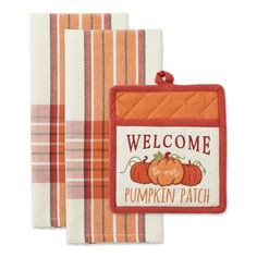 two towels with pumpkins on them and the words welcome to pumpkin patch in red