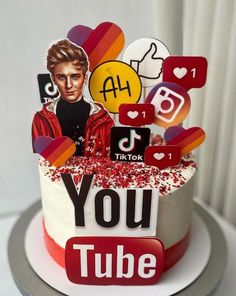 a cake decorated with an image of a woman on top and the words youtube above it