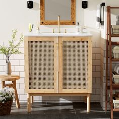 a bathroom with a sink, mirror and shelving unit in the middle of it