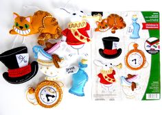 there are many decorations on the table with hats and cats in them, including an alarm clock