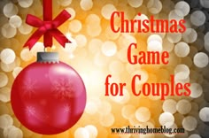 a christmas game for couples with a red ornament hanging from it's side