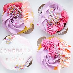 four cupcakes decorated with pink and purple frosting