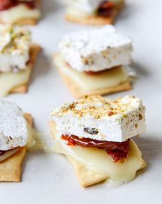 small desserts are arranged on top of each other, including cream cheese and jelly