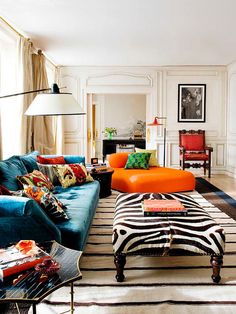 a living room filled with lots of colorful furniture