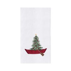 a christmas tree in a red boat with a star on it's top and a wooden paddle