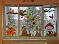 the window is decorated with animals and bees