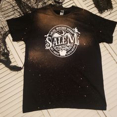 *Salem Bleached Graphic Tee *Gildan Ultra Cotton *Large- Unisex Sizing *Screen Print Transfer *Handmade **Being Hand Made, Shirts Will Come Without Tags. All Shirts Are Washed On Gentle Cycle And Laid Flat To Dry After The Bleaching Process. Fall Autumn Halloween Salem Witches Coven Cauldron Spooky Trick Or Treat Band Merch Bleached Crew Neck T-shirt, Black Bleached Cotton Tops, Washed Black Bleached Crew Neck T-shirt, Black Bleached Relaxed Fit Tops, Black Bleached Graphic Tee T-shirt, Halloween Acid Wash Cotton T-shirt, Acid Wash Cotton T-shirt For Halloween, Black Bleached Graphic Tee, Black Crew Neck T-shirt With Bleached Detail