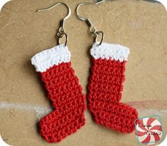 red and white knitted christmas stocking earrings with candy canes on the bottom