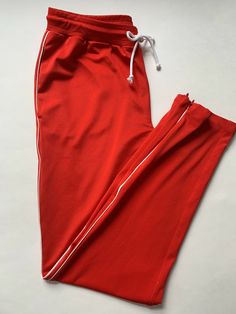 American Eagle Outfitters Joggers/Lounge Pants Women’s Size Small Red with thin White stripe down the sides Tapered leg with 6.5” zipper at bottom Side-seam pockets Elastic waistband with adjustable drawstring 95% Polyester 5% Elastane Comfortable and stretchy fit Machine washable Excellent and clean preowned condition. No flaws. Approximate measurements: Waist: 14.5” Rise: 10.5” Length: 39” Inseam: 29” Clean smoke free home. If you would like more details please ask. Thank you for looking. Lounge Pants Womens, Sweat Pant, Jogger Sweatpants, Pants Women, Lounge Pants, Tapered Legs, White Stripe, American Eagle Outfitters, American Eagle