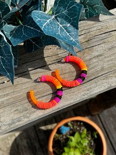 Neon orange colored hoops beaded with size 11 seed beads. Orange Hoop Earrings With Colorful Beads, Handmade Orange Hoop Earrings, Trendy Orange Beaded Earrings For Summer, Orange Small Hoop Jewelry For Summer, Trendy Small Hoop Orange Earrings, Orange Small Hoop Summer Jewelry, Bohemian Orange Hoop Earrings For Summer, Orange Bohemian Small Hoop Earrings, Summer Small Hoop Orange Jewelry