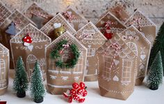 small brown paper bags with christmas decorations on them