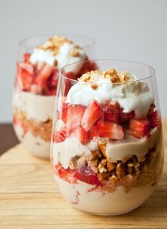 two desserts with strawberries, nuts and yogurt