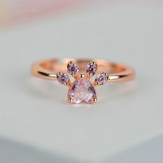 This Heart Shaped Pink Morganite Paw Print 14K Rose Gold Ring. Ring is a perfect gift for the animal lover / cat lover / dog lover in your life! Please remember that you can customize this ring in any way you would like in 3D. As well please remember it takes up to 21 days to make and ship this item. Paw Print Ring, Paw Jewelry, Paw Ring, Dog Ring, Dog Jewelry, Cat Paw, Black Diamond Ring, Classy Jewelry, Fancy Jewellery