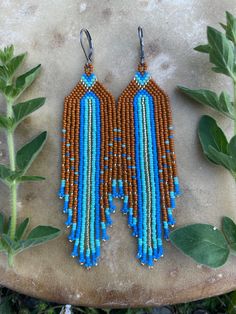 Lightweight, hand-beaded with tiny size 15 miyuki beads. Bohemian Teardrop Dangling Beads, Adjustable Artisan Dangle Beads, Southwestern Blue Beaded Earrings With Round Beads, Adjustable Brown Beaded Earrings For Festival, Artisan Adjustable Beaded Earrings With Tiny Beads, Adjustable Artisan Beads With Dangling Details, Brown Heishi Beaded Jewelry, Brown Handwoven Round Bead Jewelry, Artisan Tiny Beads Earrings For Festival