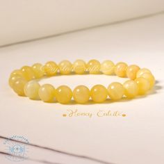 "Honey Calcite Beaded Bracelet Yellow Gemstone Stone Stretch Bracelet Meditation Yoga Bracelet Crystal Gift for Mom Friends Everyday Wear Material : Honey Calcite, Gemstone Stones, Natural Crystal, Raw Stone Quality: AAA+ Length: fit for 6.3 ~ 7.3 inches wrists Beads size: 8mm Your bracelet will arrive beautifully packaged in a gift bag ,The bracelet is made on non fray stretch nylon cord for strength and flexibility. All beads are carefully selected. When you put on and off your bracelet \"roll\" it on instead of stretching to avoid putting stress on the elastic. This will keep the high quality elastic in better condition for a longer time. It is a unique and meaningful gift for yourself or someone special. Perfect cool gift that anyone will love! These happy bracelet can't help but make Elegant Amber Beaded Bracelets With 8mm Beads, Elegant Yellow Stretch Bracelet With Round Beads, Elegant Yellow Beaded Stretch Bracelet, Elegant Yellow Stretch Bracelet, Elegant Yellow Bracelets With 8mm Beads, Mom Friends, Honey Calcite, Yellow Gemstones, Yoga Bracelet