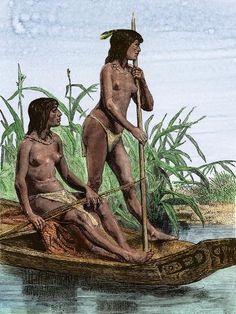 two native americans in a canoe on the water