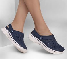 Enjoy easy-wearing comfort with Skechers Foamies GO WALK 7 - Joyous. This casual clog features a lightweight and perforated EVA upper with a contoured footbed and Comfort Pillar Technology for added support. | Skechers Women's Foamies: GO WALK 7 - Joyous Shoes | Medium Width | Sculpted and perforated Foamies EVA upper | Comfort Pillar Technology for added support | Contoured cushioned footbed | Casual clog design with convertible heel strap | Durable dual-density traction outsole for stability | Cold Weather Hats, Shoes Flats Sandals, Lace Up Wedges, Wide Shoes, Waterproof Shoes, Skechers Women, Slipper Sandals, Lace Up Sandals, Clogs Shoes