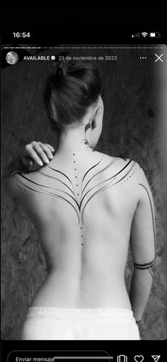 the back of a woman's body with lines drawn on her upper and lower back