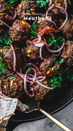 meatballs with onions and herbs in a skillet