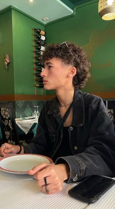 young boy’s side profile on green walls background showcasing a curly mullet hairstyle Lowfade Taper Mullet, Short Curly Hair Inspo Men, Curly Mullet Masc, Burst Fade Mohawk Curly Hair, Curly Mullet Fade, Short Hair Perm Pixie Cuts, Mens Curly Mullet