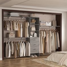 an open closet with clothes and shoes on the shelves, in front of a bed