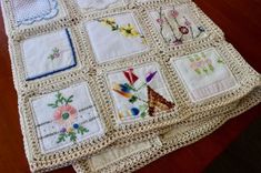 a crocheted table cloth with many different designs on it