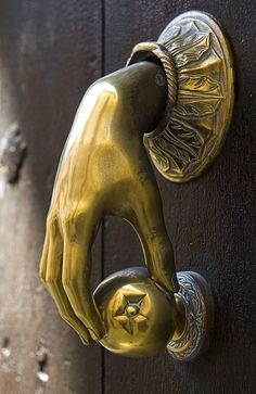 a close up of a door handle with a star on the front and back of it